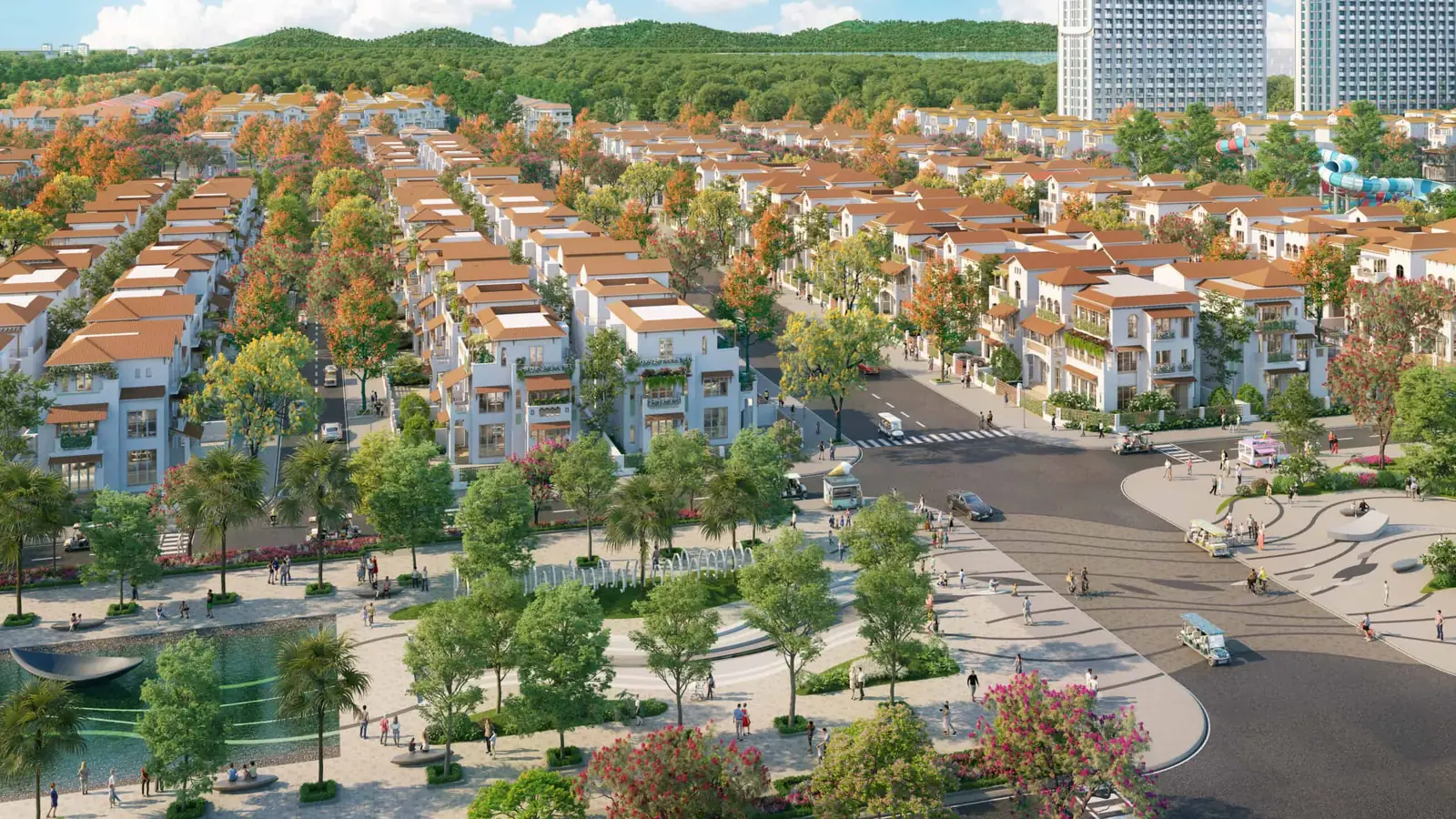 Phối cảnh từ trên cao khu nhà phố thấp tầng Blanca City với đường cây hoa nhiều màu, quảng trường nước và cầu trượt công viên nước phía xa